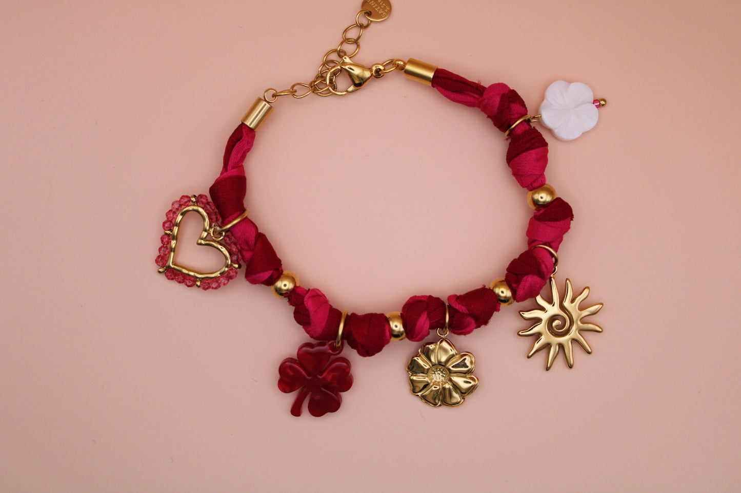 Bracelet tissus rose et charms